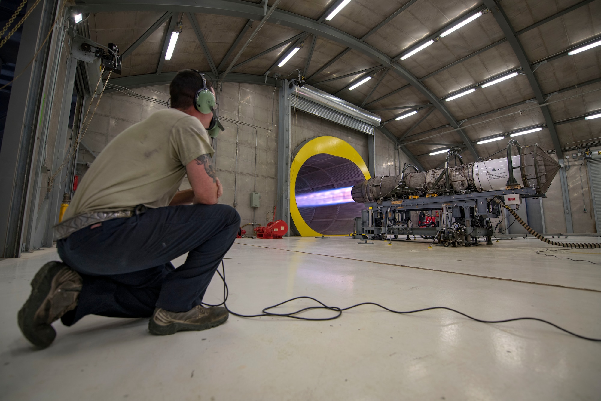 Senior Airman Bradley Linsley, 49th Component Maintenance Squadron test cell technician overlooks an F-16 Viper engine run, Oct. 17, 2019, on Holloman Air Force Base, N.M. The test cell ensures engines are reliable for flight by checking oil levels, leaks, rotations per minute, and temperatures during testing. (U.S. Air Force photo by Staff Sgt. Christine Groening)