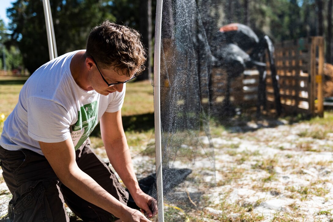 Staff Sgt. Cory Schollmeyer, 23d Civil Engineer Squadron pest management Airman, builds part of the 40th Moooody Haunted House Oct. 10, 2019, in Valdosta, Ga. On average, it takes nearly 1,000 volunteer hours to construct and run the haunted house. It costs nearly $5K for the materials and decorations, and requires a minimum of 24 volunteers per night to operate the haunted house. (U.S. Air Force photo by Airman 1st Class Hayden Legg)
