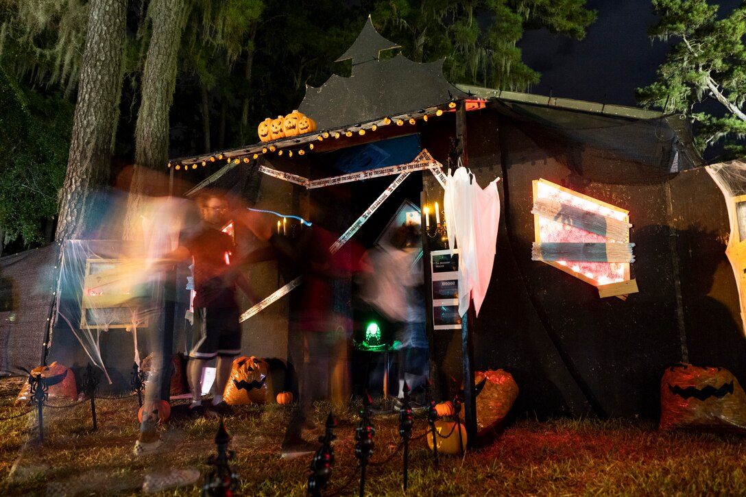 Attendees enter the 40th Moooody Haunted House Oct. 18, 2019, in Valdosta, Ga. On average, it takes nearly 1,000 volunteer hours to construct and run the haunted house. It costs nearly $5K for the materials and decorations, and requires a minimum of 24 volunteers per night to operate the haunted house. (U.S. Air Force photo by Airman 1st Class Taryn Butler)