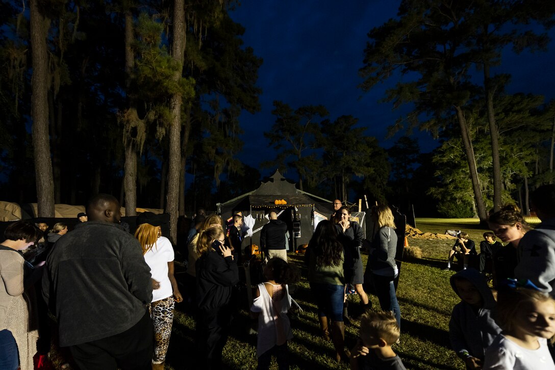 Attendees wait in line for the 40th Moooody Haunted House Oct. 18, 2019, in Valdosta, Ga. On average, it takes nearly 1,000 volunteer hours to construct and run the haunted house. It costs nearly $5K for the materials and decorations, and requires a minimum of 24 volunteers per night to operate the haunted house. (U.S. Air Force photo by Airman 1st Class Hayden Legg)