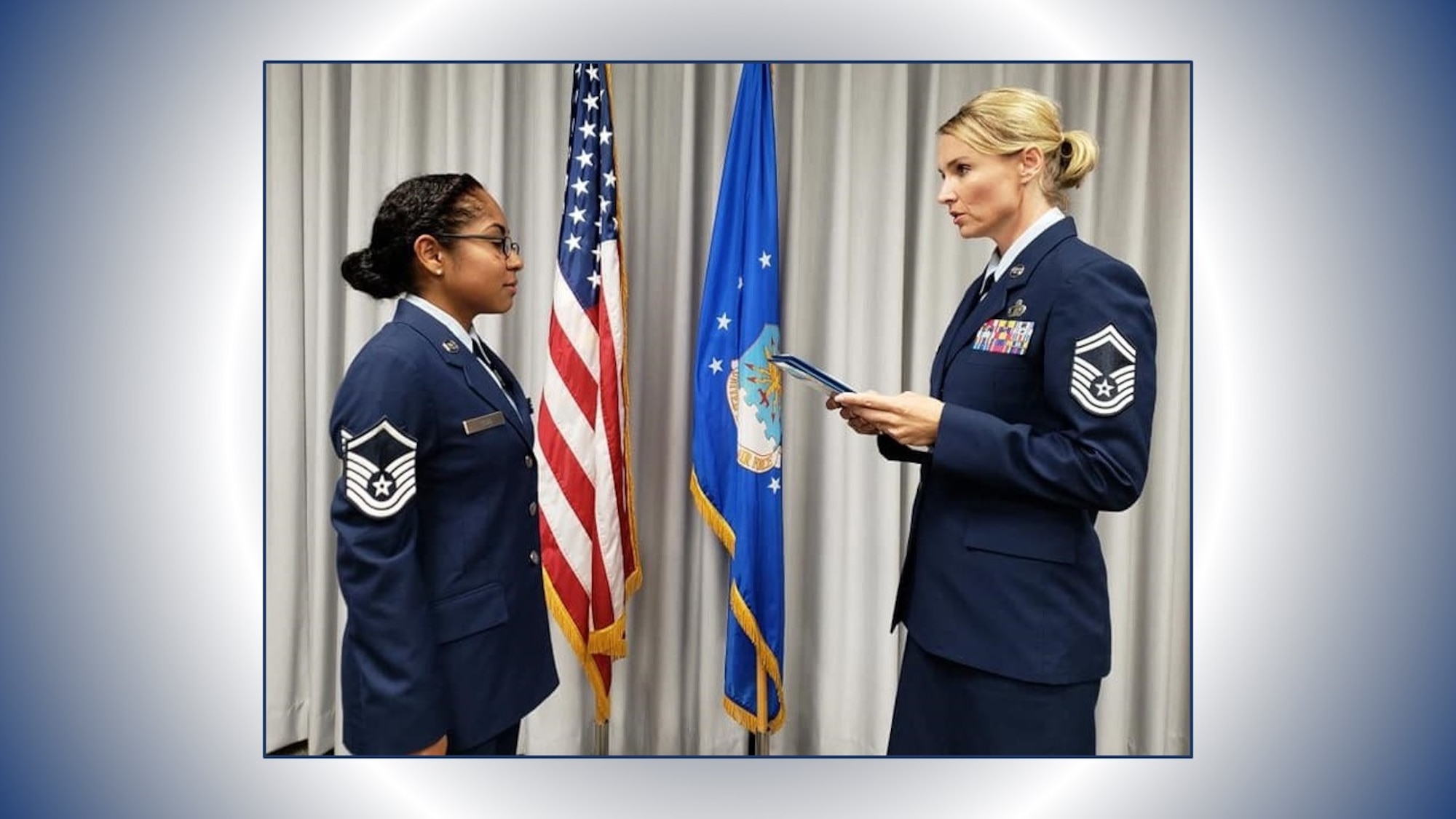 Senior Master Sgt. Laura Garcia, 340th FTG Military Personnel Section superintendent, administers the SNCO oath to new SNCO corps inductee, Master Sgt. Natasha Todd, September 6 at Joint Base San Antonio-Randolph, Texas. (U.S. Air Force photo by Debbie Gildea)