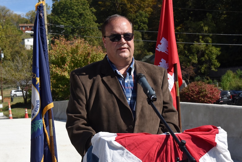 Jeff Wilder, president of the Cumberland Chamber of Commerce, serves as master of ceremonies for the dedication Oct. 21, 2019 of Shepherd Street Bridge in Cumberland, Ky. The U.S. Army Corps of Engineers Nashville District and contractor Bush & Burchett, Inc., constructed the bridge as part of a flood risk reduction project on Looney Creek. (USACE photo by Lee Roberts)