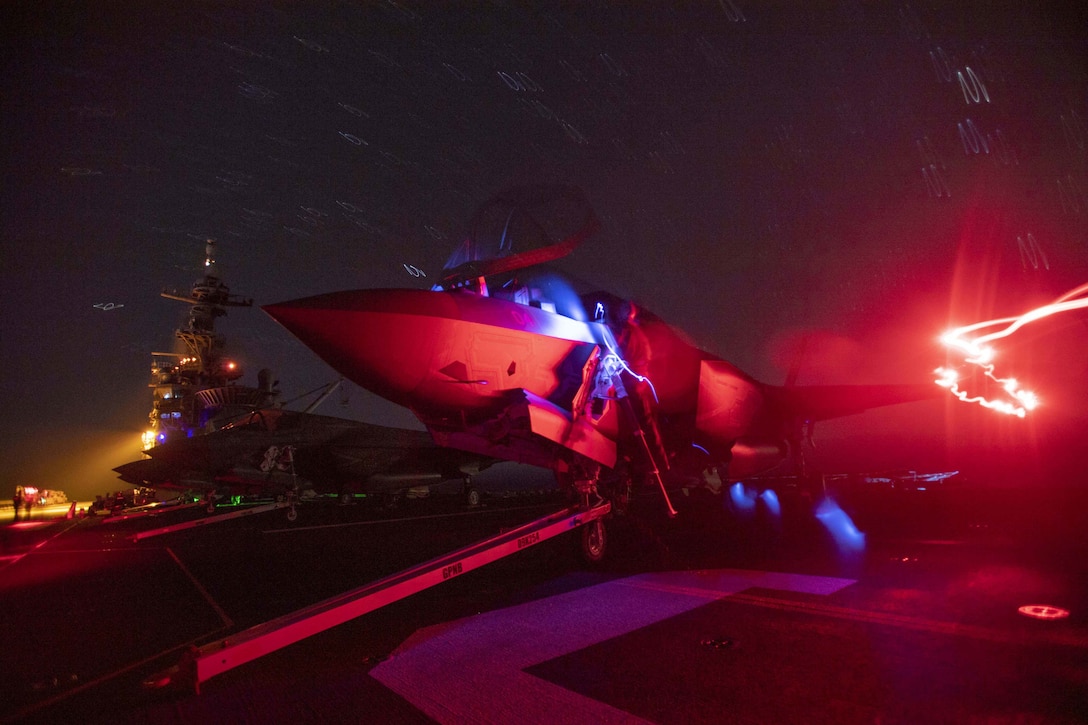 191002-N-NJ919-2011 PACIFIC OCEAN (Oct. 2, 2019) Marines assigned to the “Flying Leathernecks” of Marine Fighter Squadron (VMFA) 122 perform maintenance on an F-35B Lightning II on the flight deck of the amphibious assault ship USS America (LHA 6). America is underway conducting routine operations. (U.S. Navy photo by Mass Communication Specialist 3rd Class Walter Estrada)