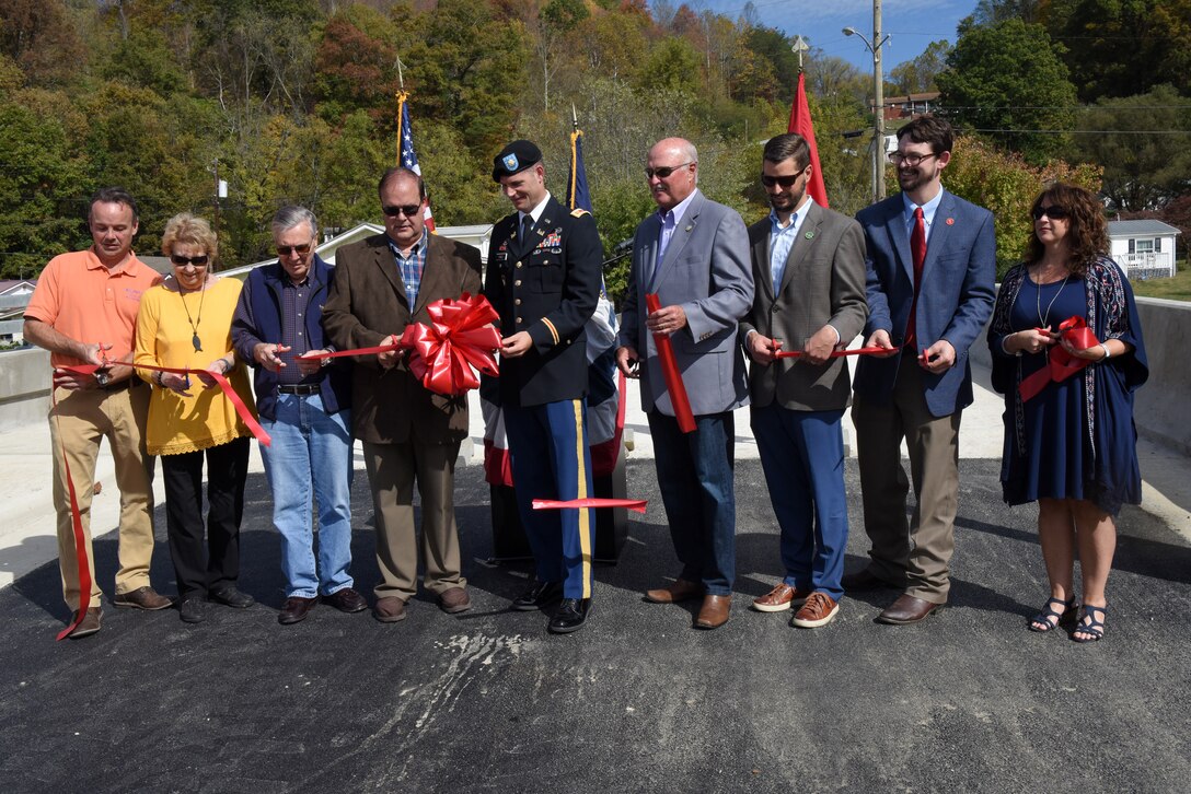 Distinguished officials cut a ribbon Oct. 21, 2019 to officially dedicate Shepherd Street Bridge in Cumberland, Ky. The U.S. Army Corps of Engineers Nashville District and contractor Bush & Burchett, Inc., constructed the bridge as part of a flood risk reduction project on Looney Creek. (USACE photo by Lee Roberts)