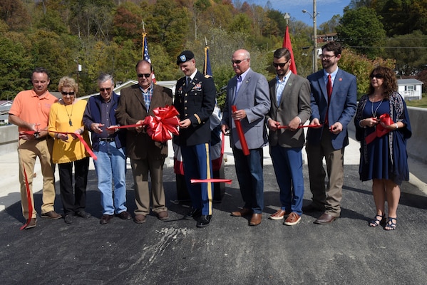 Distinguished officials cut a ribbon Oct. 21, 2019 to officially dedicate Shepherd Street Bridge in Cumberland, Ky. The U.S. Army Corps of Engineers Nashville District and contractor Bush & Burchett, Inc., constructed the bridge as part of a flood risk reduction project on Looney Creek. (USACE photo by Lee Roberts)