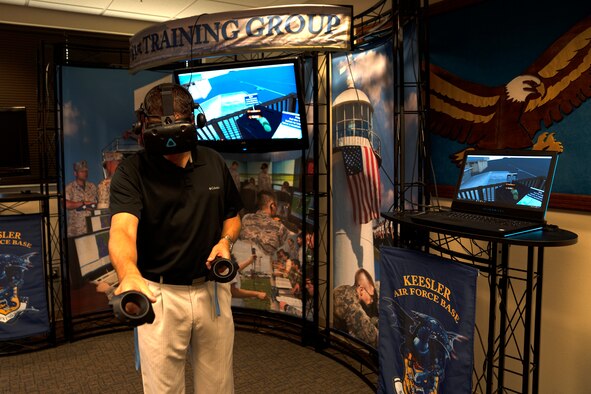 Thomas Lassabe, Trainer Development Center flight chief, demonstrates virtual reality equipment capabilities inside the Trainer Development Center at Keesler Air Force Base, Mississippi, Oct. 2, 2019. The Trainer Development Center produces equipment to further the innovative qualities for Air Force training while staying cost effective. (U.S. Air Force photo by Airman 1st Class Kimberly L. Mueller)