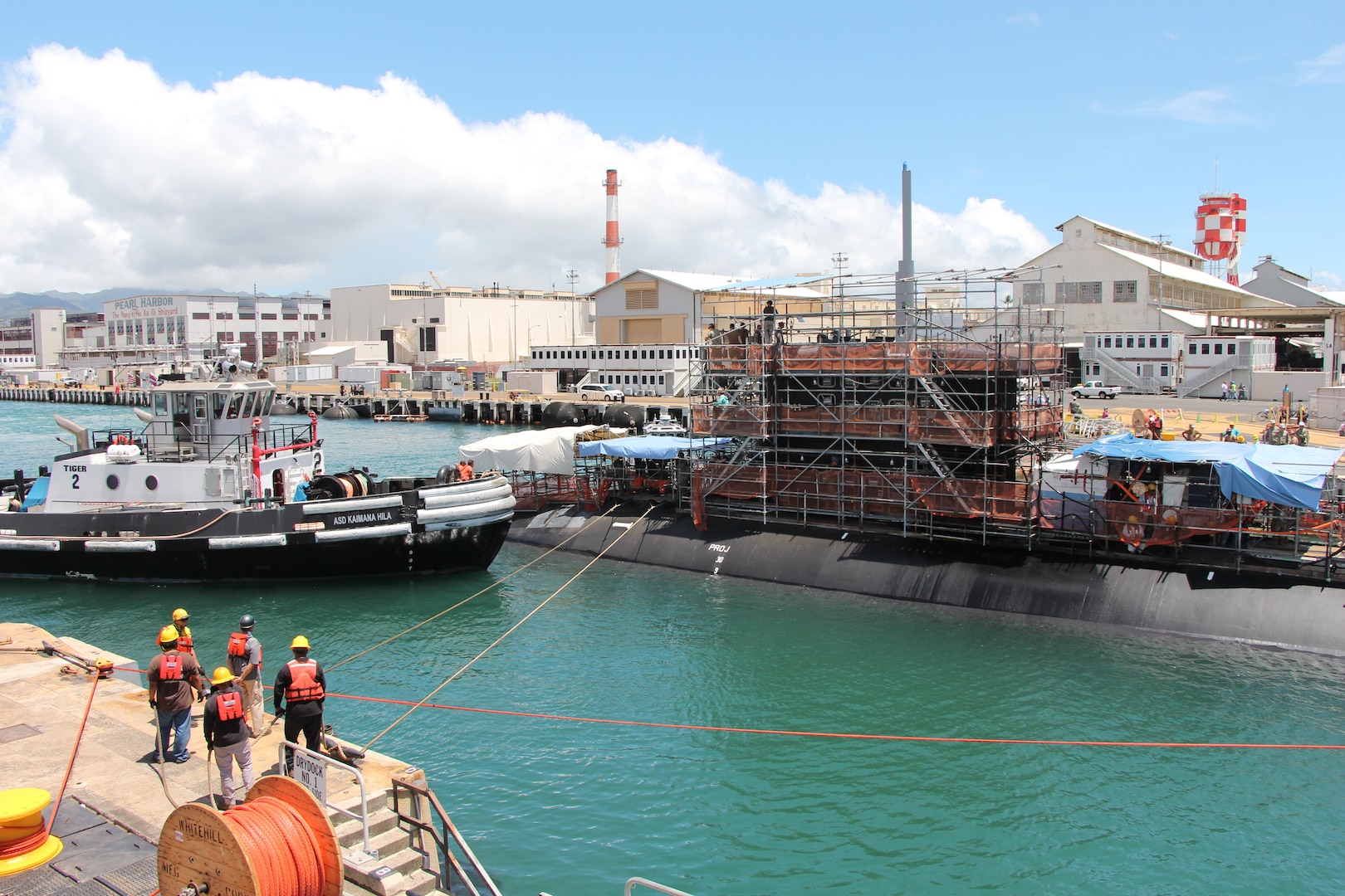Shipyard workers carefully undock the USS Missouri (SSN-780) from Pearl Harbor Naval Shipyard & IMF’s Dry Dock One on 4 September 2019. The undocking occurred just two weeks after Dry Dock One’s celebrated centennial.