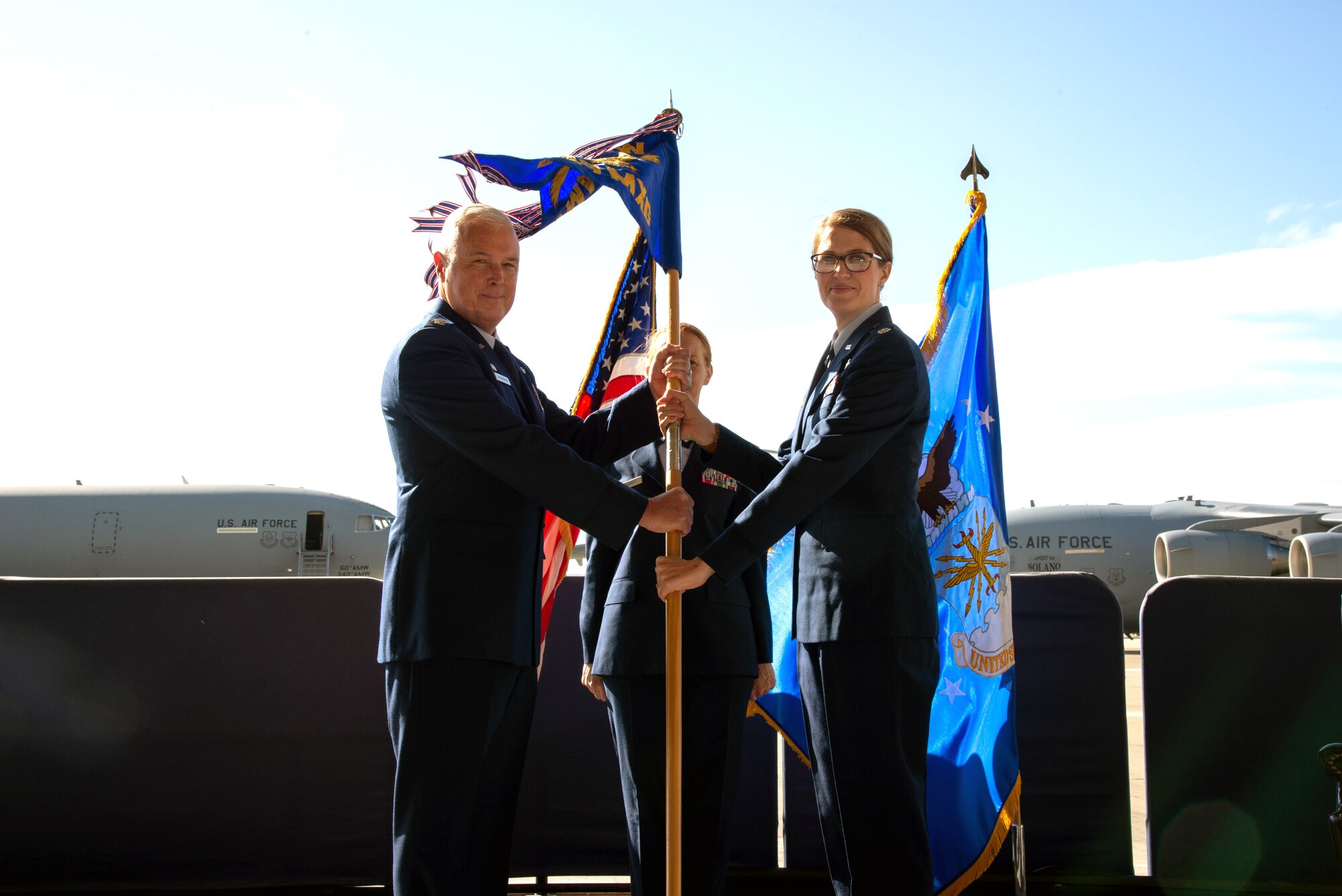 Lt. Col. Erin Cook assumes command of the 349th Maintenance Group from Col. Scott McLaughlin, 349th Air Mobility Wing commander, during a ceremony Oct. 19, 2019.