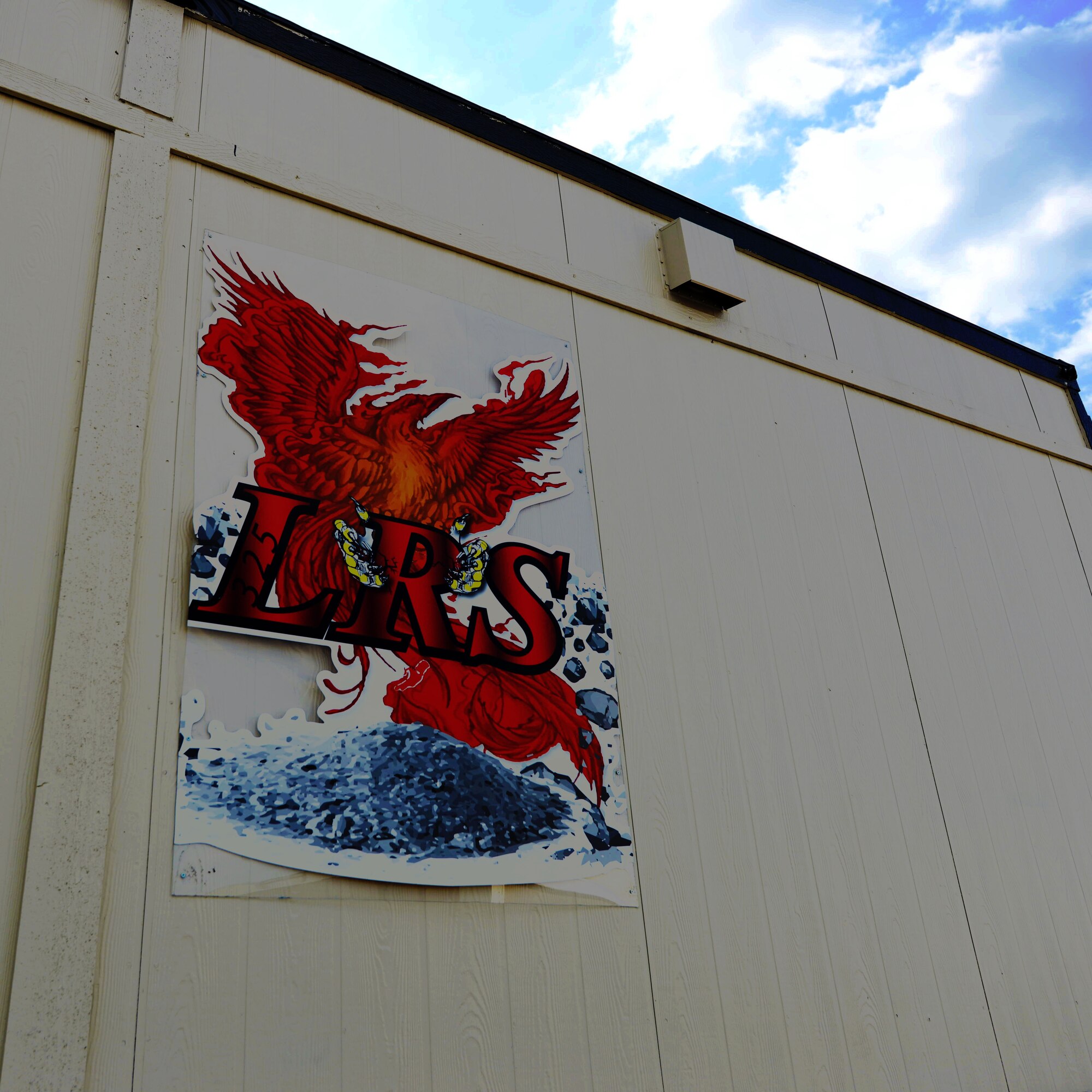 Unit artwork is displayed at the 325th Logistics Readiness Squadron on Oct. 1, 2019, at Tyndall Air Force Base, Florida. The squadron recently vacated 500,080 items from the unit’s warehouse, which was permanently damaged by Hurricane Michael last year. (U.S. Air Force photo by Airman 1st Class Bailee A. Darbasie)