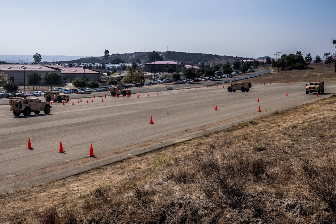 U.S. Marines conduct cone skill drills during the I Marine Expeditionary Force Joint Light Tactical Vehicle Operator New Equipment Training course in 13 Area on Marine Corps Base Camp Pendleton, California, Oct. 17, 2019. The JLTV OPNET course is an eight day training evolution teaching students the vehicle’s characteristics, operations, operator maintenance and safety. (U.S. Marine Corps photo by Lance Cpl. Alison Dostie)