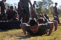 U.S. Marines with Marine Corps Security Force Regiment (MCSFR) prepare to do squad push-ups during a field meet October 18, 2019 at Naval Weapons Station Yorktown, Virginia.