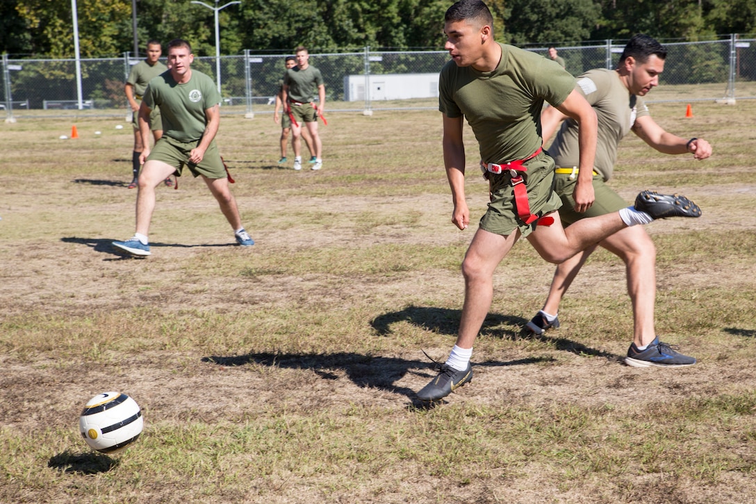 U.S. Marine Corps Lance Cpl. Andy A. Romero with Charlie Fleet Anti-terrorism Security Team, Marine Corps Security Force Regiment (MCSFR), plays soccer during a field meet October 18, 2019 at Naval Weapons Station Yorktown, Virginia. The field meet competitions included soccer, flag football, a workout competition, pugil stick bouts, and tug-of-war. The field meet was designed to increase esprit de corps within MCSFR by creating a competitive environment for Marines. (U.S. Marine Corps photo by Sgt. Danielle Prentice/released)