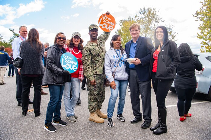 Capt. Cedric McNeal, commanding officer of Naval Surface Warfare Center Carderock Division, and Combined Federal Campaign (CFC) leadership celebrate the start of the 2019 fundraising season with a tailgate and car show event at Carderock’s West Bethesda, Md., headquarters on Oct. 17, 2019. (U.S. Navy photo by Nicholas Brezzell/Released)