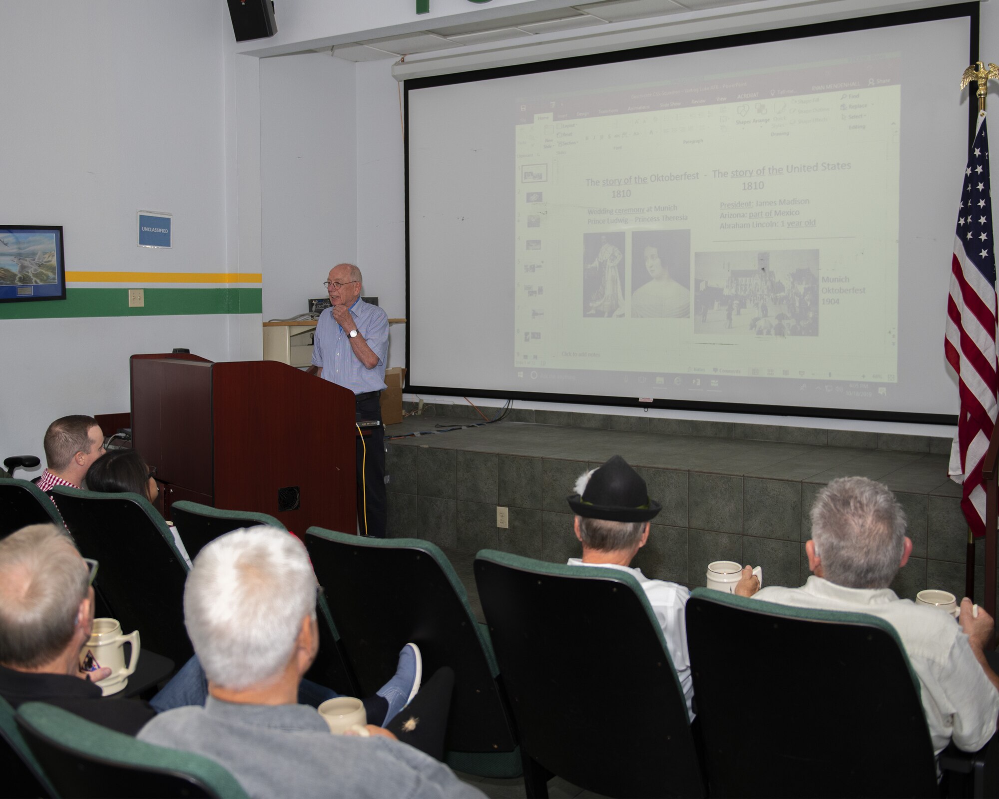 Retired German air force Maj. Gen. Hans Juergen Merkle, former commander of the Cactus Starfighter Squadron, shares the history of the Cactus Starfighter Squadron with members of the 310th Fighter Squadron, Oct. 18, 2019, at Luke Air Force Base, Ariz.