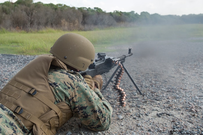 U.S. Marine Corps Master Sgt. Patrick H. Hammer, a student in the Marine Advisor Course, fires a PKM machine gun during foreign weapons training in Moyock, North Carolina, Sept. 17, 2019.