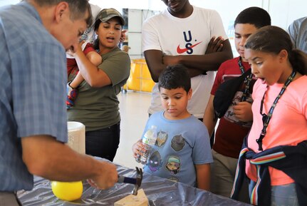 IMAGE: VIRGINIA BEACH, Va. (Sept. 20, 2019) – Scott Gingrich, Naval Surface Warfare Center Dahlgren Division (NSWCDD) physicist, conducts a liquid nitrogen demonstration with a group of fifth graders. Gingrich was among 30 scientists and engineers from NSWCDD Dam Neck Activity and NSWCDD who educated students through hands-on Science, Technology, Engineering and Mathematics (STEM) displays throughout the weekend at Naval Air Station Oceana's fourth annual STEM Lab. (U.S. Navy photo by George Bieber/Released)