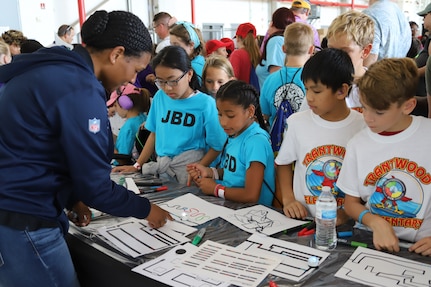 IMAGE: VIRGINIA BEACH, Va. (Sept. 20, 2019) – Lace Bacchus, Naval Surface Warfare Center Dahlgren Division (NSWCDD) cyber security engineer, demonstrates how Ozobots follow hand-drawn paths. She was among 30 scientists and engineers from Naval Surface Warfare Center Dahlgren Division (NSWCDD) Dam Neck Activity and NSWCDD who educated students through hands-on displays at Naval Air Stations Oceana’s fourth annual Science, Technology, Engineering and Mathematics Lab. (U.S. Navy photo by George Bieber/Released)