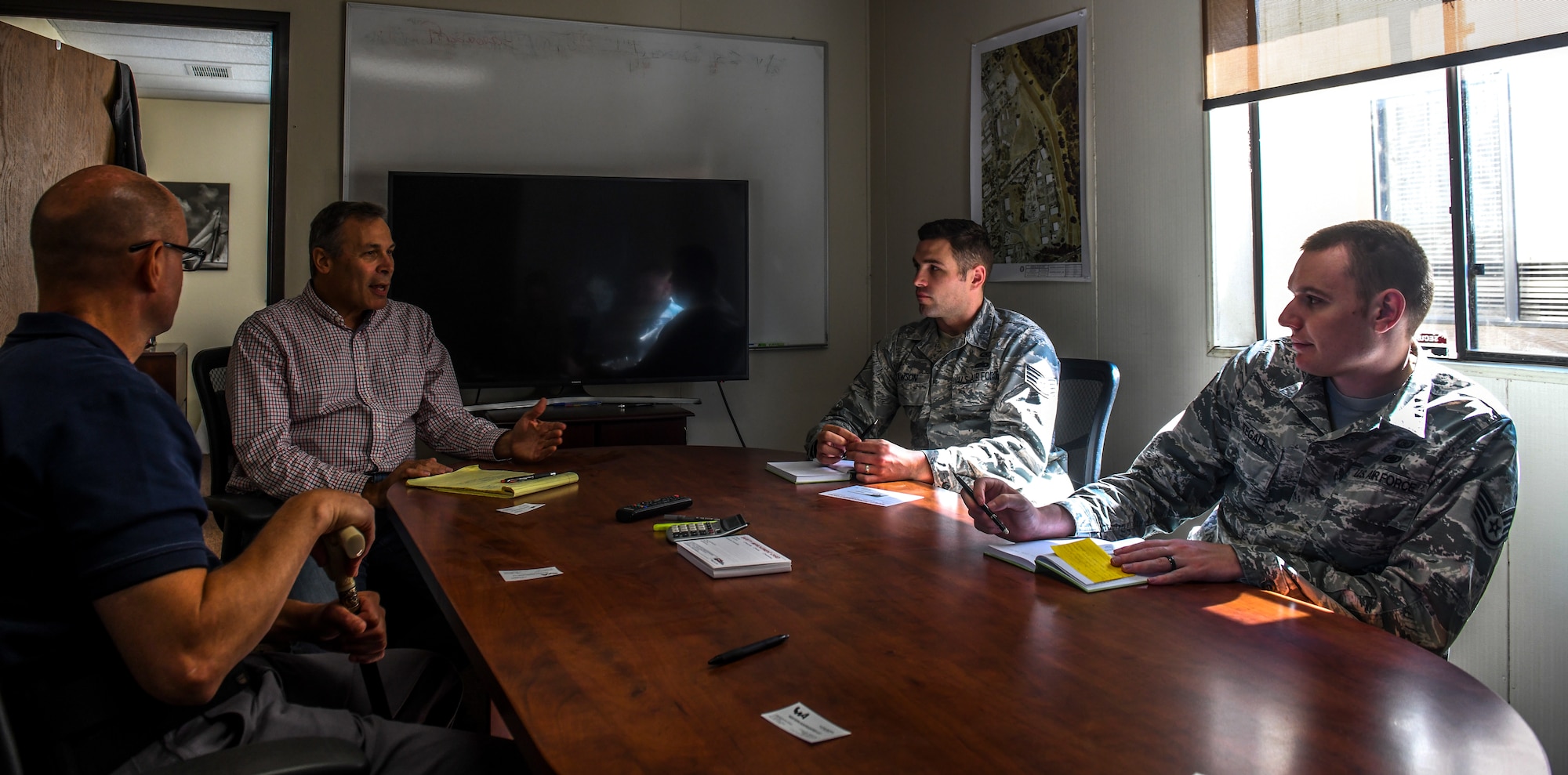 Members of the 9th Reconnaissance Wing safety office meet and talk with Lloyd Burns, Western Aggregates vice president (center), in Marysville, California, Oct. 10, 2019. Meeting with Western Aggregate gave a chance for both groups to work together and figure out a better solution to help Airmen and families. (U.S. Air Force Photo by Senior Airman Colville McFee)