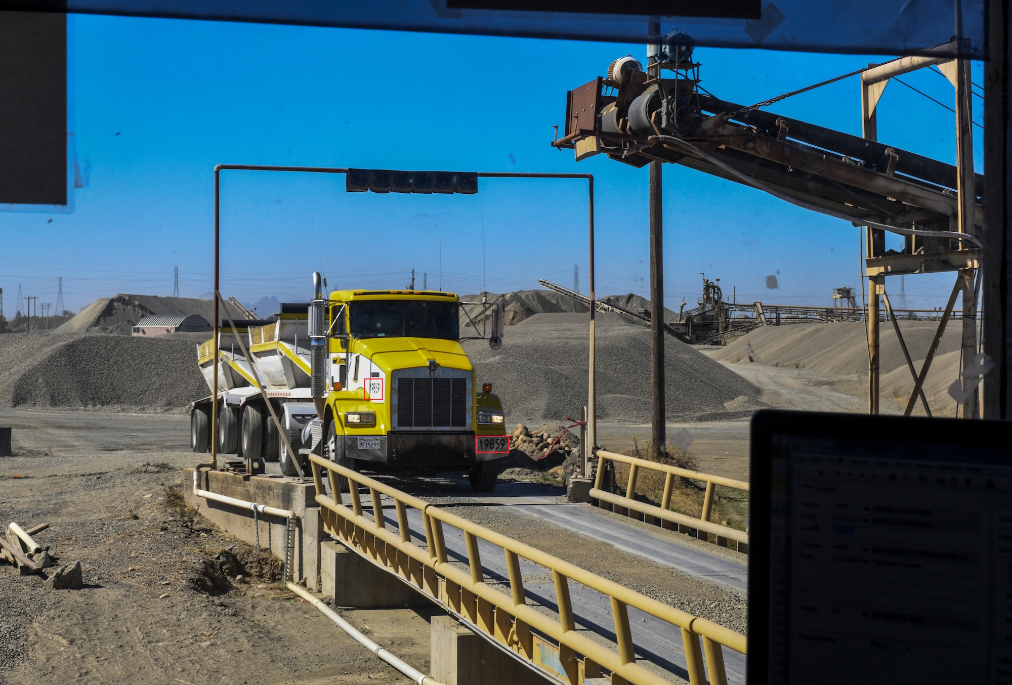 A contracted truck drives onto the weight bay in Marysville, California, Oct. 10, 2019. Some indicators that can be used to identify a truck would be the five digit number (circled in red) that allows you to contact the company about any incident (U.S. Air Force Photo by Senior Airman Colville McFee)