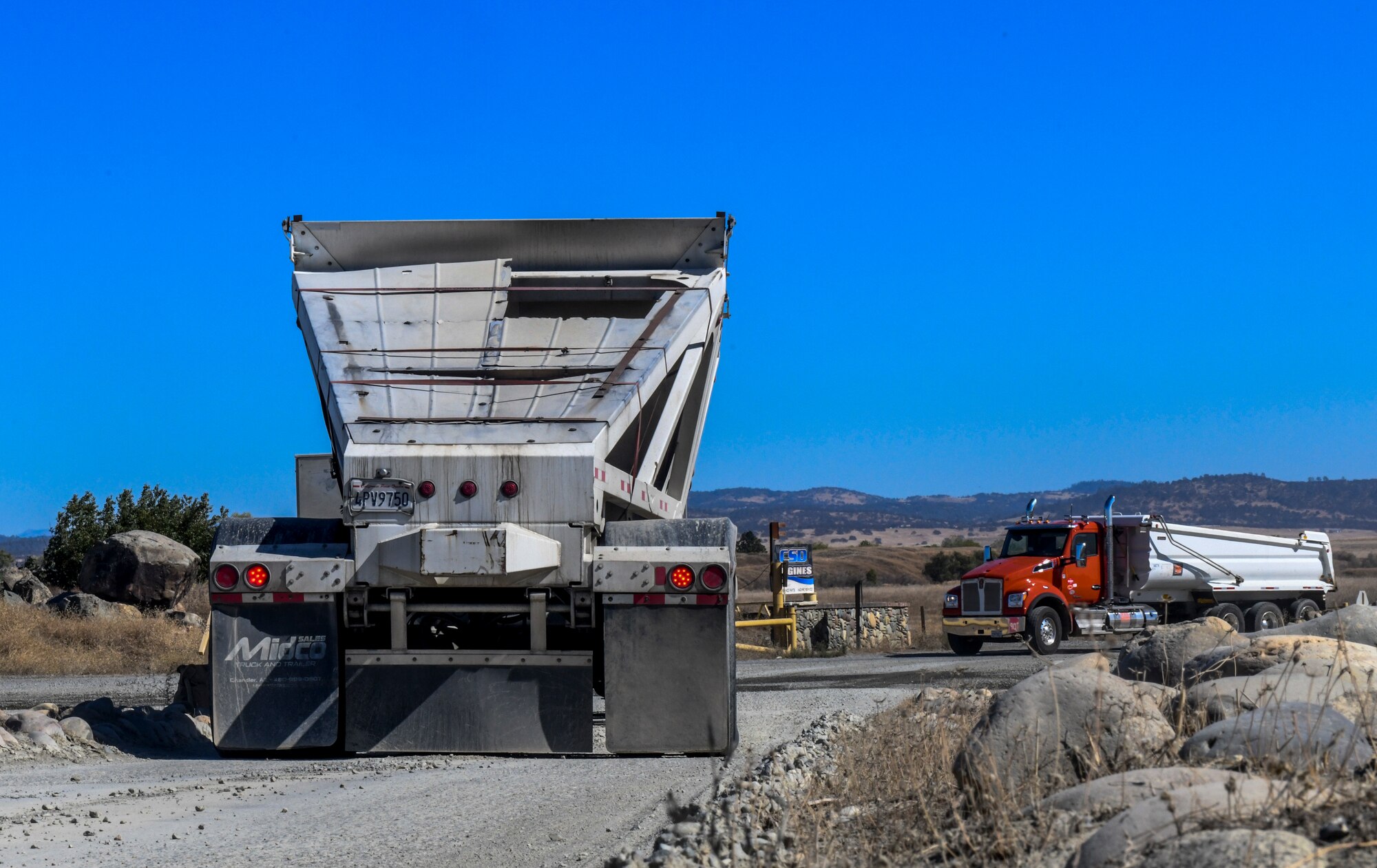 A contracted truck drives off after being weighed in Marysville, California, Oct. 10, 2019. There are some indicators that can be used to identify a truck but the license tags are not good indicators to use because the trailer gets switched multiple times to different trucks. (U.S. Air Force Photo by Senior Airman Colville McFee)
