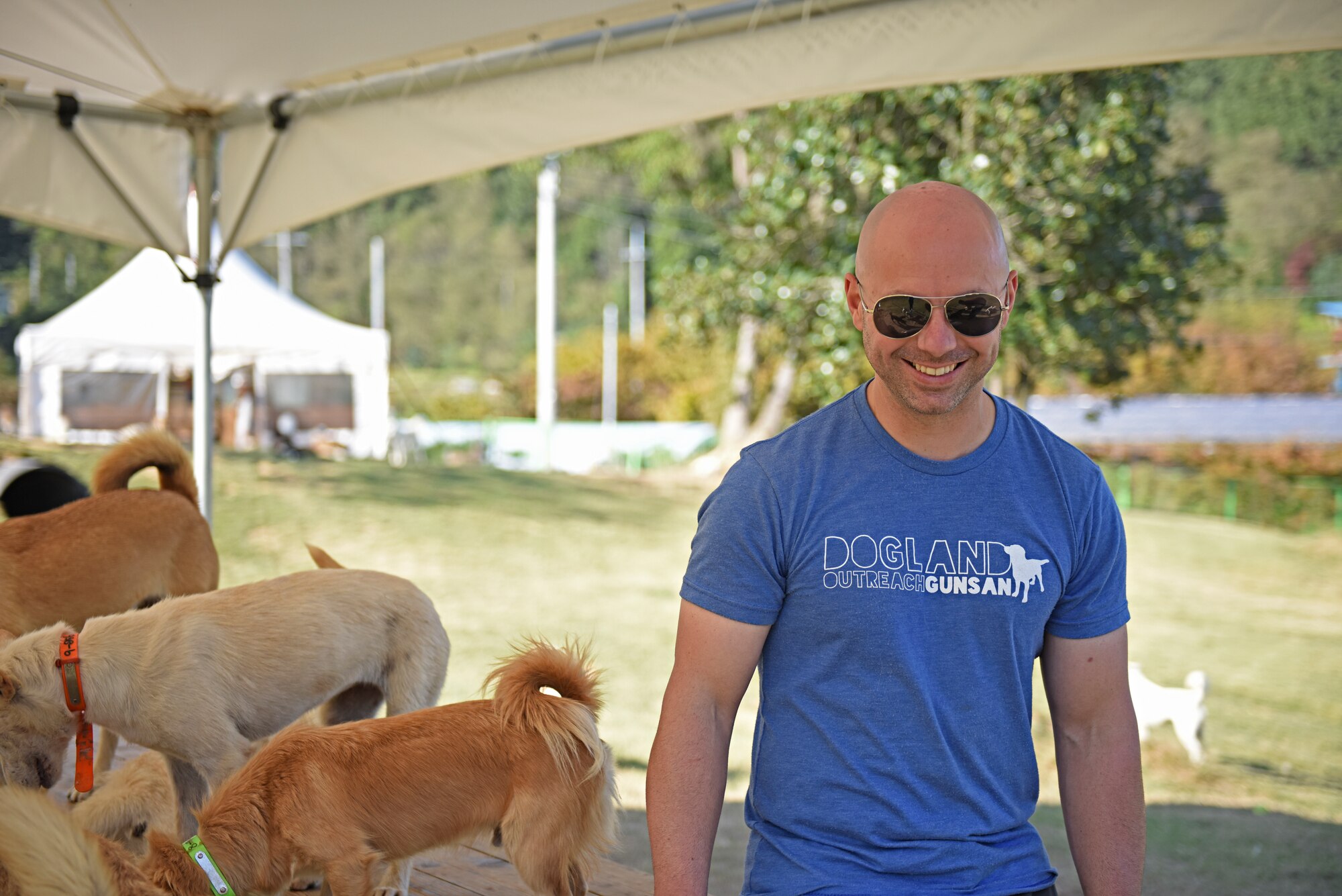 Master Sgt. Mason Bergeron, 8th Operations Support Squadron aircraft flight equipment flight chief and Dog Land Outreach president, volunteers at Gunsan Dog Land, Gunsan, Republic of Korea, Oct. 20, 2019. Since arriving in Korea, Bergeron has rescued five abandoned dogs from the Gunsan area. (U.S. Air Force photo by Staff Sgt. Mackenzie Mendez)