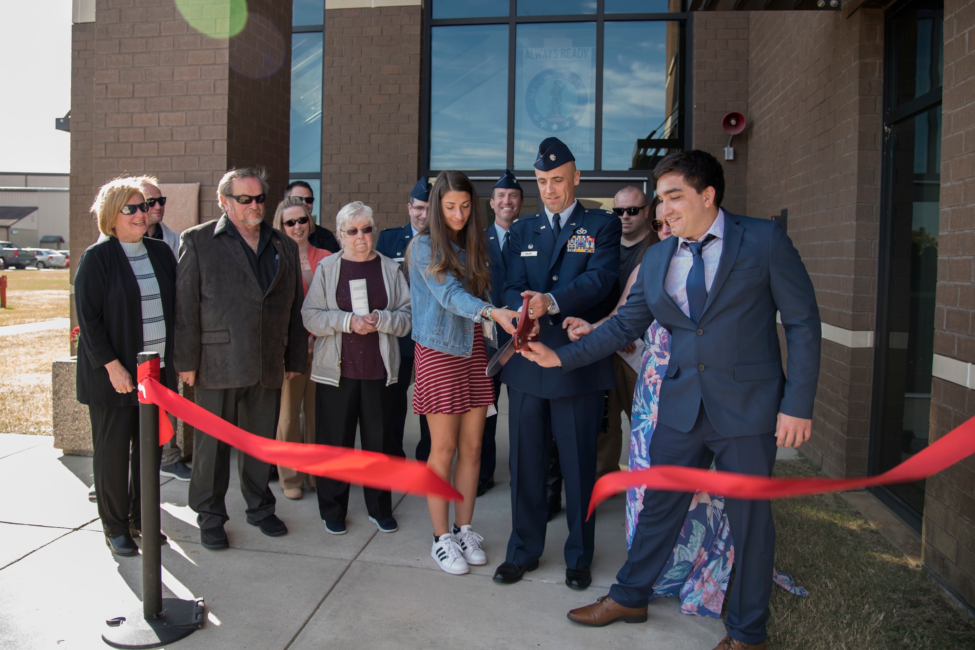 Family and friends of Capt. Robert M. Mendez cut a ribbon during the 108th Civil Engineer Squadron building's dedication ceremony at Joint Base McGuire-Dix-Lakehurst, N.J., Oct. 19, 2019. The building was dedicated to Mendez who passed away in January 2017 after being diagnosed with kidney cancer in late 2018. Mendez was the deputy base civil engineer for the 108th CES. (U.S. Air National Guard photo by Senior Airman Julia Santiago)