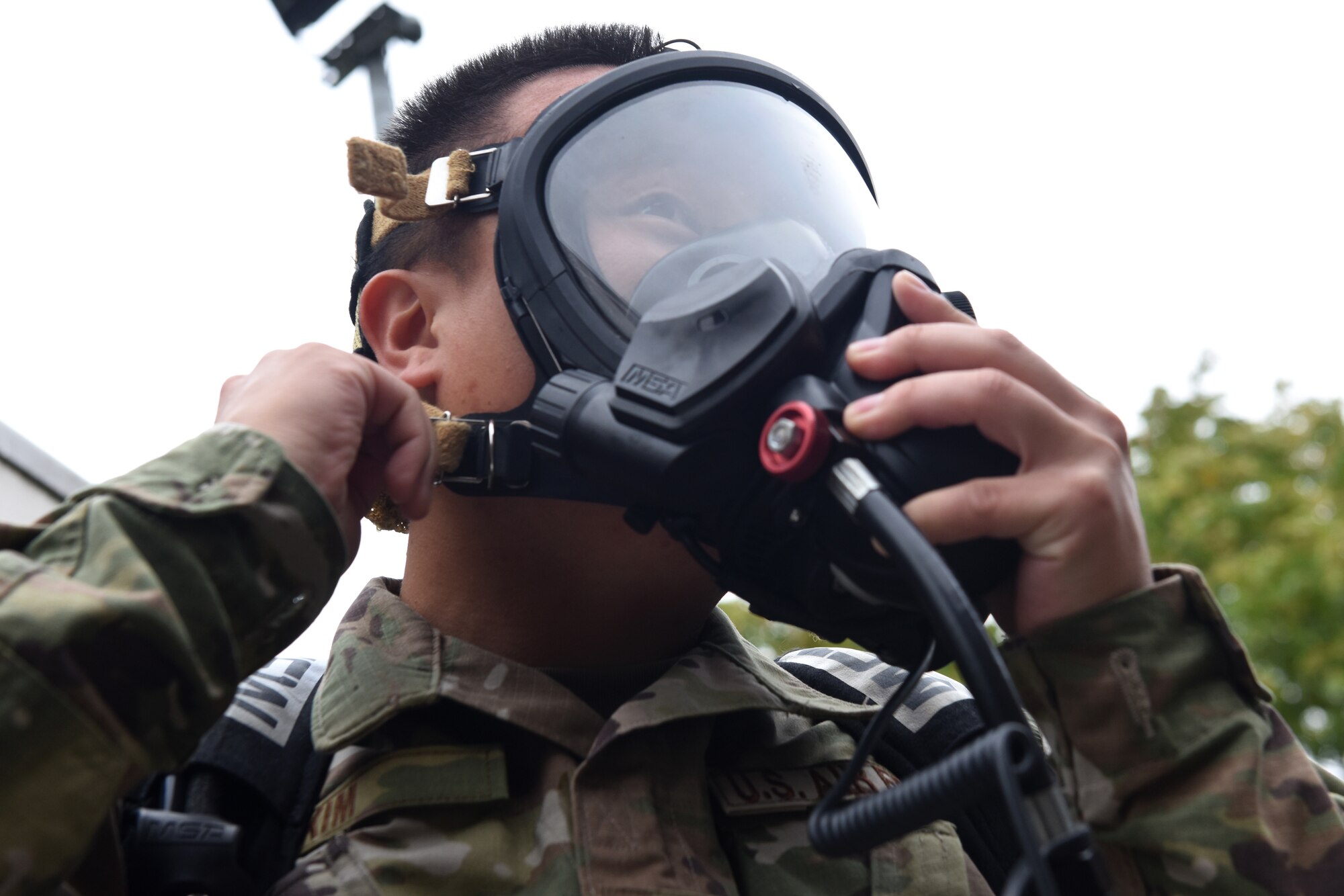 Senior Airman Tyler Kim, bioenvironmental technician assigned to the 48th Aerospace Medicine Squadron, recently demonstrated how to gear up at Royal Air Force Lakenheath, England. A Self-Contained Breathing Apparatus is used to provide breathable air in emergency situations that are dangerous to life or the health atmosphere. (U.S. Air Force photo by Airman 1st Class Rhonda Smith)