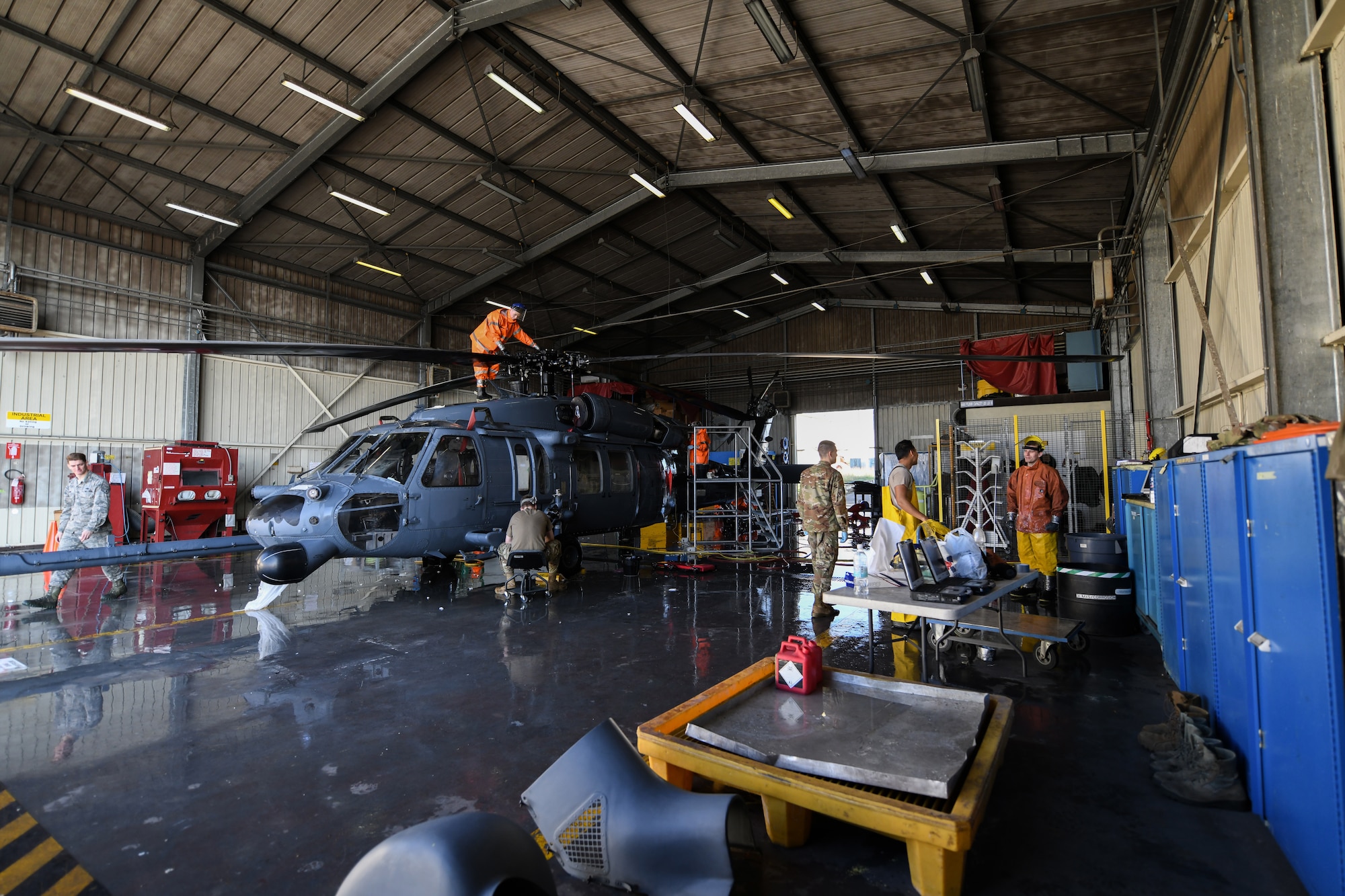 U.S Airmen from the 31st Aircraft Maintenance Squadron, 56th Helicopter Maintenance Unit, wash an HH-60G Pave Hawk helicopter at Aviano Air Base, Italy, Oct. 22, 2019. The primary mission of the HH-60G Pave Hawk helicopter is to conduct day or night personnel recovery operations out of hostile environments. (U.S. Air Force photo by Airman 1st Class Ericka A. Woolever).