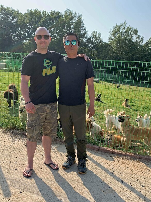 Master Sgt. Mason Bergeron, 8th Operations Support Squadron aircraft flight equipment flight chief and Dog Land Outreach president, and Lee, Jung-Ho, Gunsan Dog Land director, have rescued five dogs together from the Gunsan area since Bergeron arrived at Kunsan Air Base, Republic of Korea, in March 2019. Through the power of connection and social media, Bergeron has recruited more than 150 active duty military members to volunteer at Gunsan Dog Land. (Courtesy Photo)