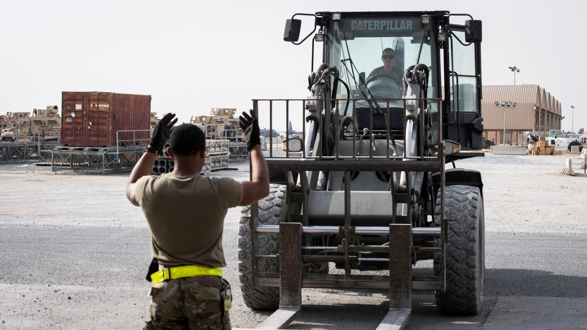 Staff Sgt. Samuel Johnson,left , and Staff Sgt. Shari Blackburn,right , 386th Expeditionary Logistics Readiness Squadron aerial port cargo processing representatives, move a forklift at Ali Al Salem Air Base, Kuwait, Oct. 17, 2019. Port cargo processing representatives, also known as “Port Dawgs,” ensure that cargo transported on military aircraft or ground vehicles arrive safely and quickly to their destinations. From food and medical supplies to helicopters and ground vehicles, Port Dawgs at the 386th Air Expeditionary Wing provide the supplies needed for war-winning air power in the U.S. Central Command area of responsibility.