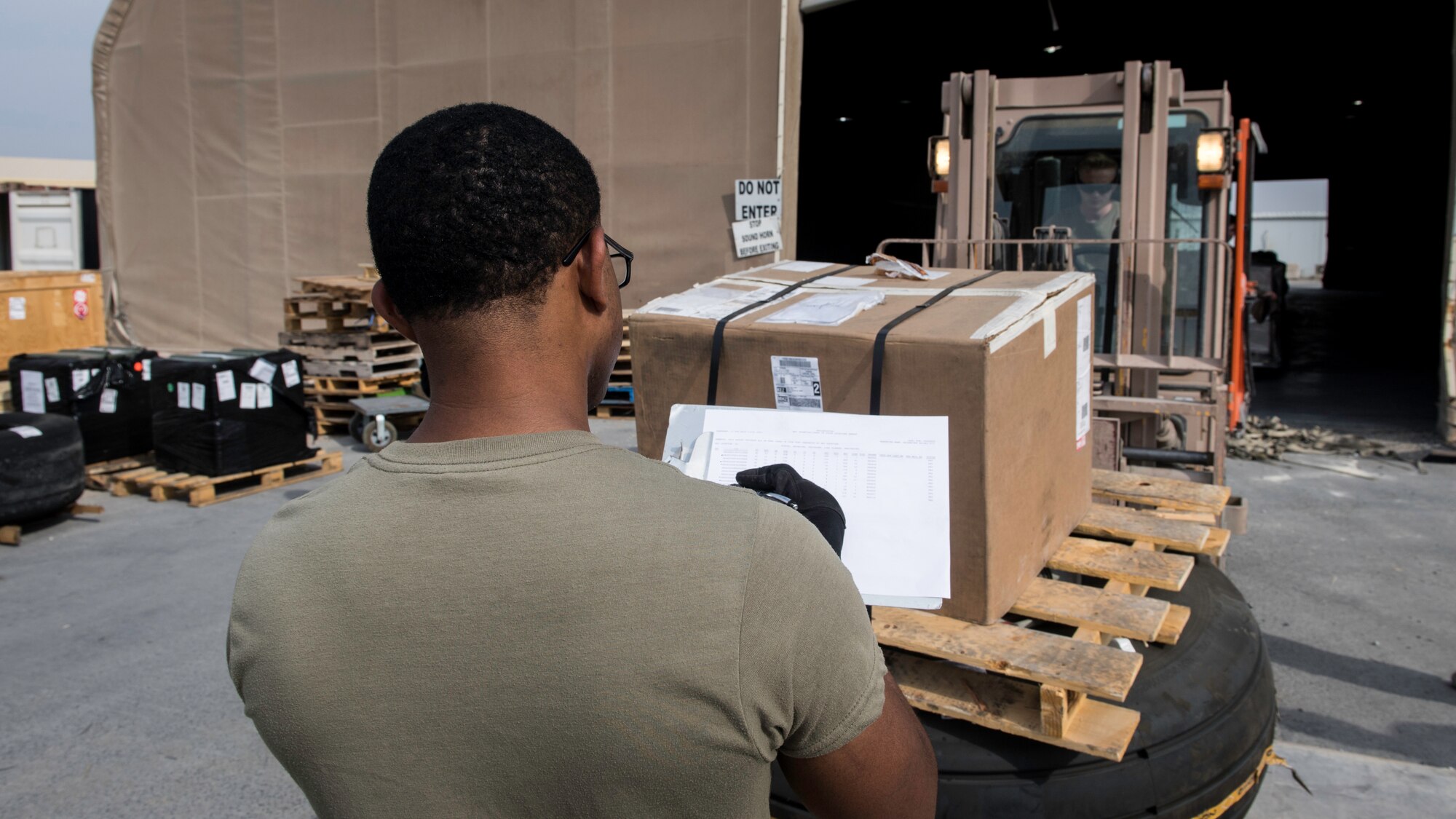 Staff Sgt. Samuel Johnson, 386th Expeditionary Logistics Readiness Squadron aerial port cargo processing representative, verifies a cargo manifest at Ali Al Salem Air Base, Kuwait, Oct. 17, 2019. Port Dawgs are responsible for inspecting and building cargo pallets and leading the cargo onto outbound aircraft, which supply various locations within the U.S. Central Command area of responsibility.