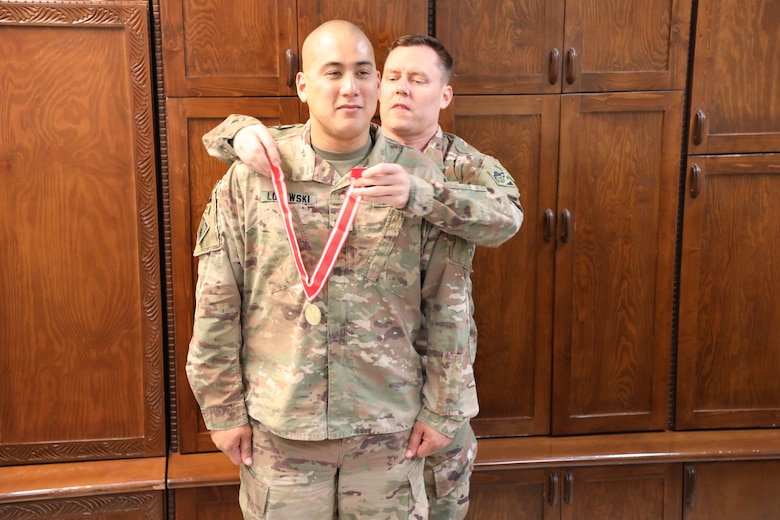 Afghanistan District Deputy Commander Army Lt. Col. Dan Hayden presents the Bronze de Fleury Medal to Maj. Mark Lojewski during a ceremony at Bagram Airfield, Afghanistan, on Oct. 22, 2019. The de Fleury Medal is one of the highest awards a member of the U.S. Army Corps of Engineers (USACE) can receive and is presented to only a few Soldiers every year. The Bronze de Fleury Medal may be presented to an individual who has rendered significant service or support to an element of the Engineer Regiment.