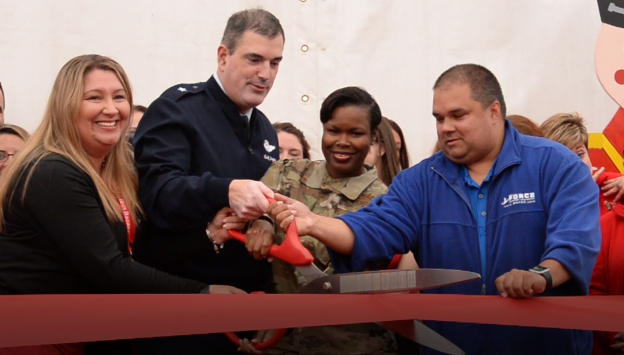 U.S. Air Force Brig. Gen. Mark R. August, 86th Airlift Wing commander, and members of the 86th Airlift Wing cut the opening ribbon for the bazaar at Ramstein Air Base, Germany, Sept. 11, 2019. The annual bazaar raises money for the base and features a variety of vendors selling food and other merchandise.
