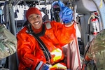 A Nebraska Army National Guard Soldier smiles after being “rescued” by a Nebraska Task Force One firefighter from Stagecoach Lake using a hoist from a Nebraska Army National Guard UH-60 Blackhawk helicopter during Operation Titan Fall, a domestic emergency response exercise, Oct. 19, 2019, in Lincoln, Nebraska.