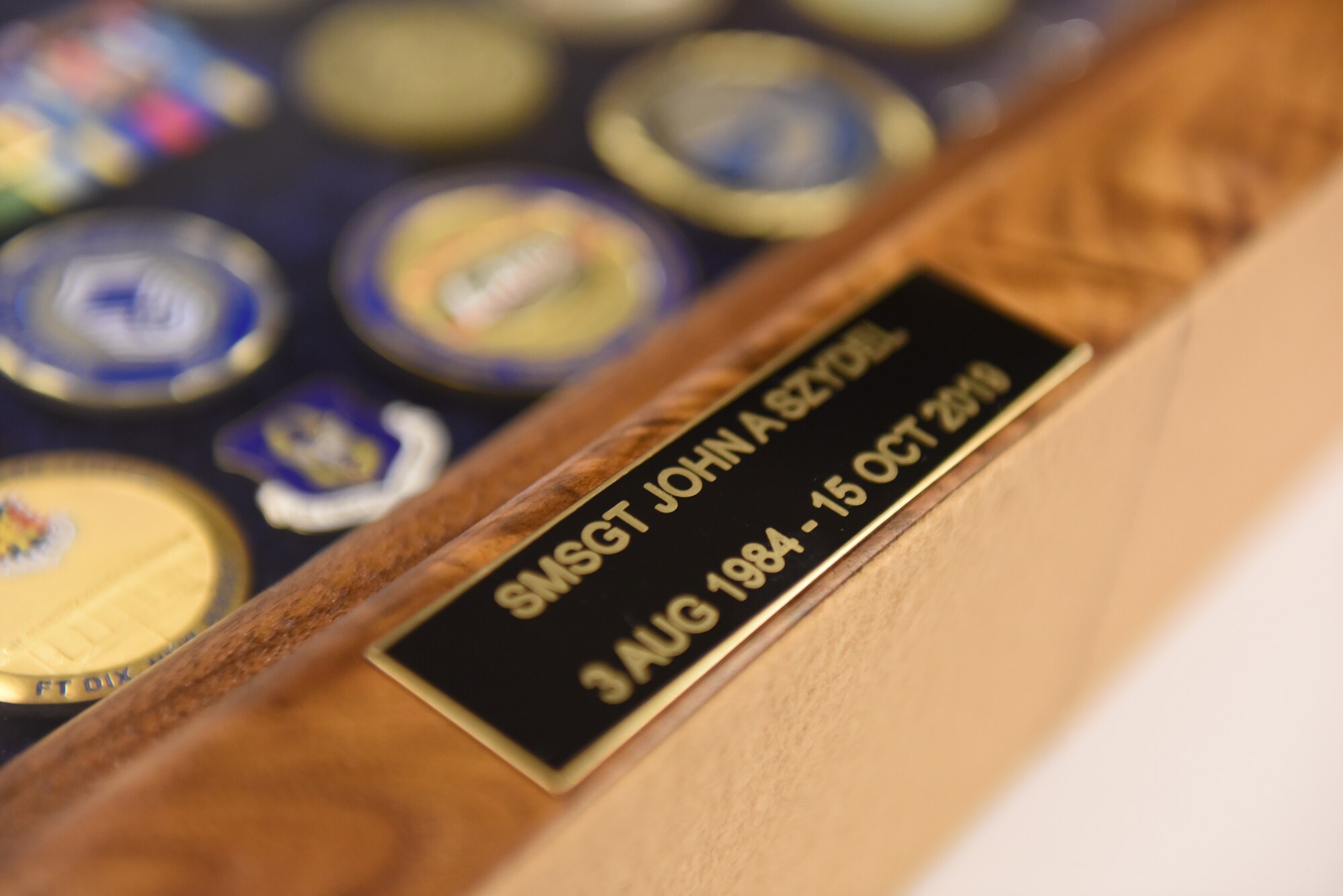A shadow box dedicated to 911th Aircraft Maintenance Squadron Specialist Flight Chief Senior Master Sgt. John A. Szydel waits to be presented during a retirement ceremony at the Pittsburgh International Airport Air Reserve Station, Pennsylvania, Oct. 5, 2019.