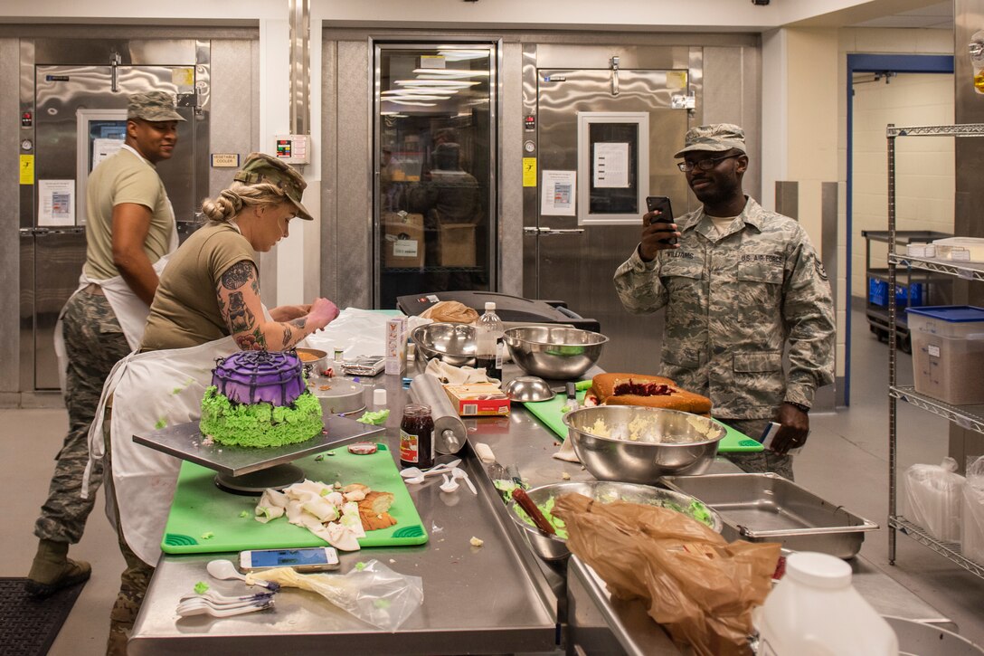 Participants bake cakes during a Scary Cake Bake-Off Oct. 23, 2019, at Moody Air Force Base, Ga. The event, hosted by the 23d Force Support Squadron, pitted two teams against each other to bake and design a Halloween-themed cake. In the end, the three judges declared Ight Imma Head Out the winning team. (U.S. Air Force photo by Airman Elijah M. Dority)