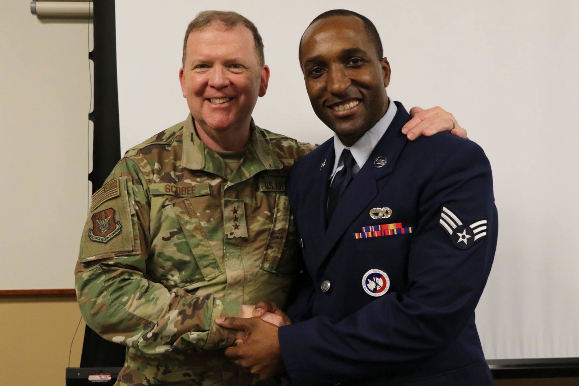 Lt. Gen. Richard W. Scobee, Commander, Air Force Reserve Command, shakes hands with a Senior Airman attached to the 452d Air Mobility Wing, March Air Reserve Base, California, during a visit to the base in April of 2019. (U.S. Air Force photo by 1st Lt. Russell McMillan)