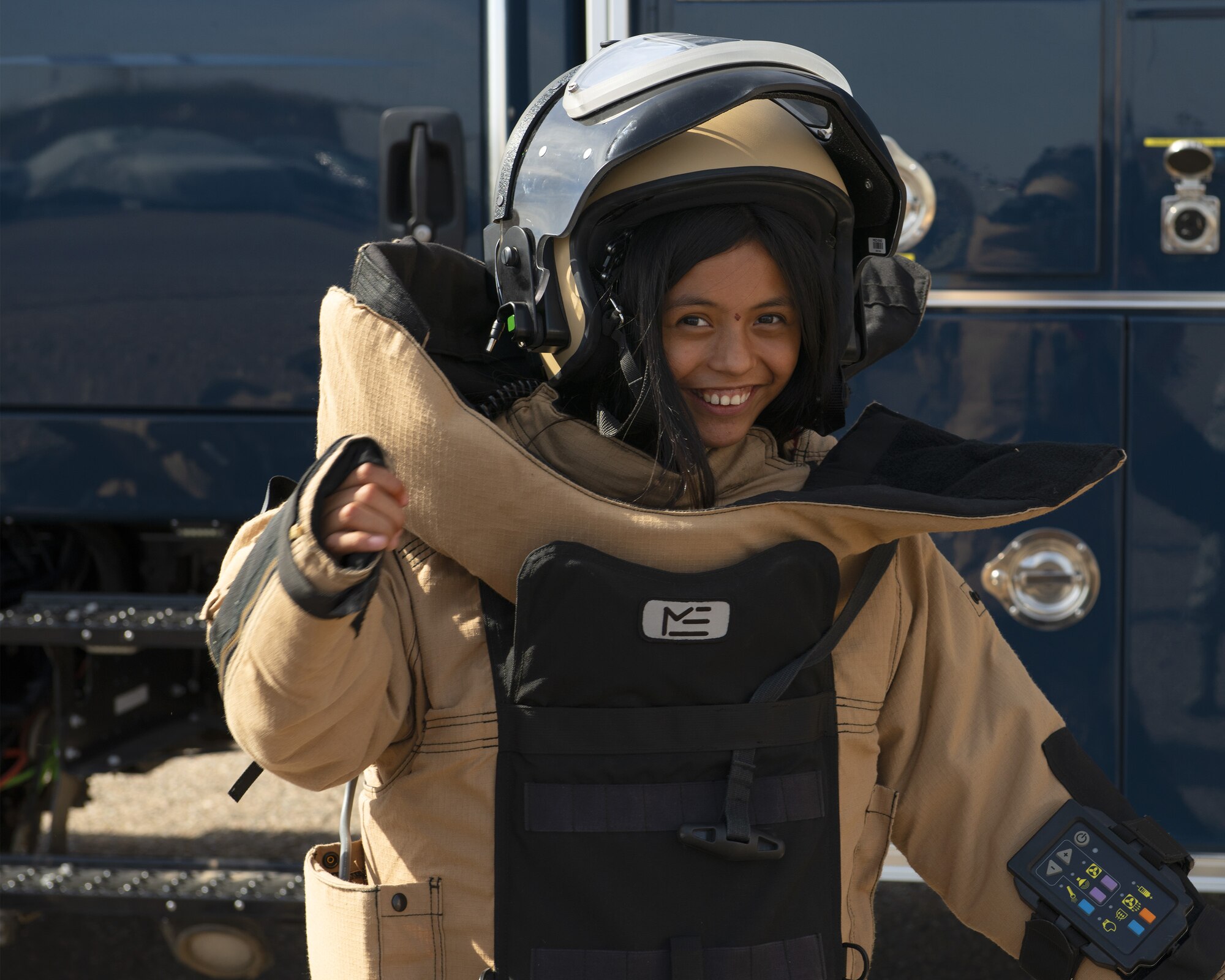 Trinity Garcia, a member of the Childhelp program, wears an Explosive Ordnance Disposal 9 bomb suit during the Childhelp Kids Day of Hope tour Oct. 16, 2019, at Luke Air Force Base, Ariz.