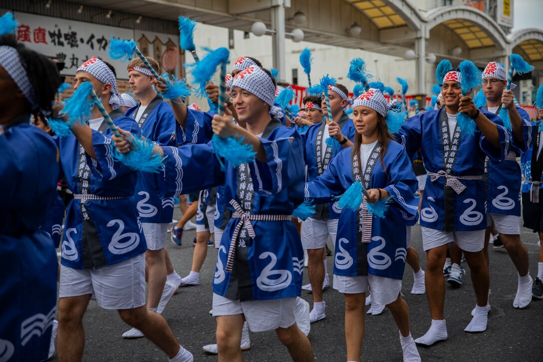 U.S. Marines from Marine Corps Air Station Iwakuni and local Japanese volunteers participate in the 63rd Iwakuni Matsuri parade in Iwakuni City, Japan, Oct. 20, 2019. The Iwakuni Matsuri Festival is an annual festival and parade that features the local community and local organizations coming together to promote safety and development in the city.