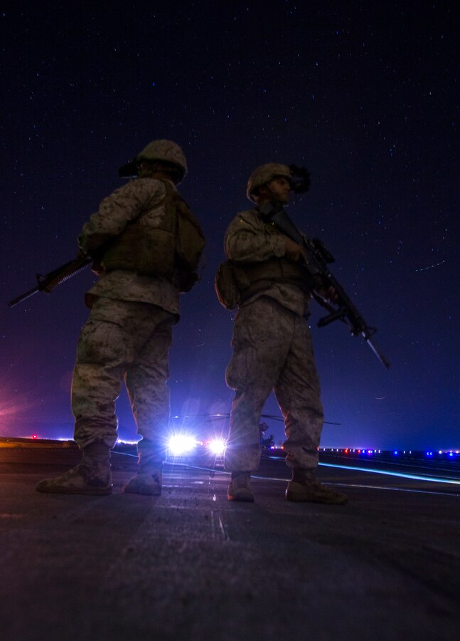 U.S. Marines with Alpha Battery, 3rd Low Altitude Air Defense Battalion (LAAD), 3rd Marine Aircraft Wing (MAW), await to board a KC-130J Hercules during a training exercise at Camp Wilson, Twentynine Palms, Calif., Oct. 22, 2019. The training focuses on operational integration of the six functions of Marine Corps Aviation in support of a Marine Air Ground Task Force. Training events such as this one ensure the Marines and machines of 3rd MAW are able and ready to respond to crisis anytime, anywhere (U.S. Marine Corps photo by Sgt. Dominic Romero).