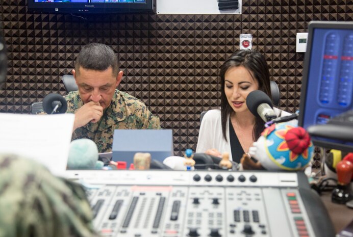 U.S. Marine Corps Sgt. Maj. Mario Marquez, the III Marine Expeditionary Force sergeant major, left, and Mari Gregory speaks on their radio show with AFN May 14, 2019, on Plaza Housing. Gregory and  Marquez have partnered up since July 2017 to provide time and space for the shared Okinawan community to understand each other and exchange friendship.