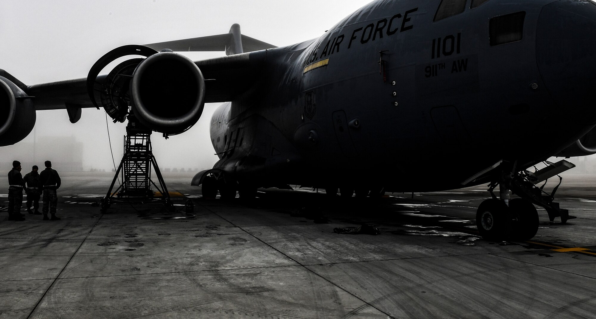 A C-17 Globemaster III assigned to the 911th Airlift Wing sits on the flightline while maintenance is performed on one of its engines at the Pittsburgh International Airport Air Reserve Station, Pennsylvania, October 21, 2019.
