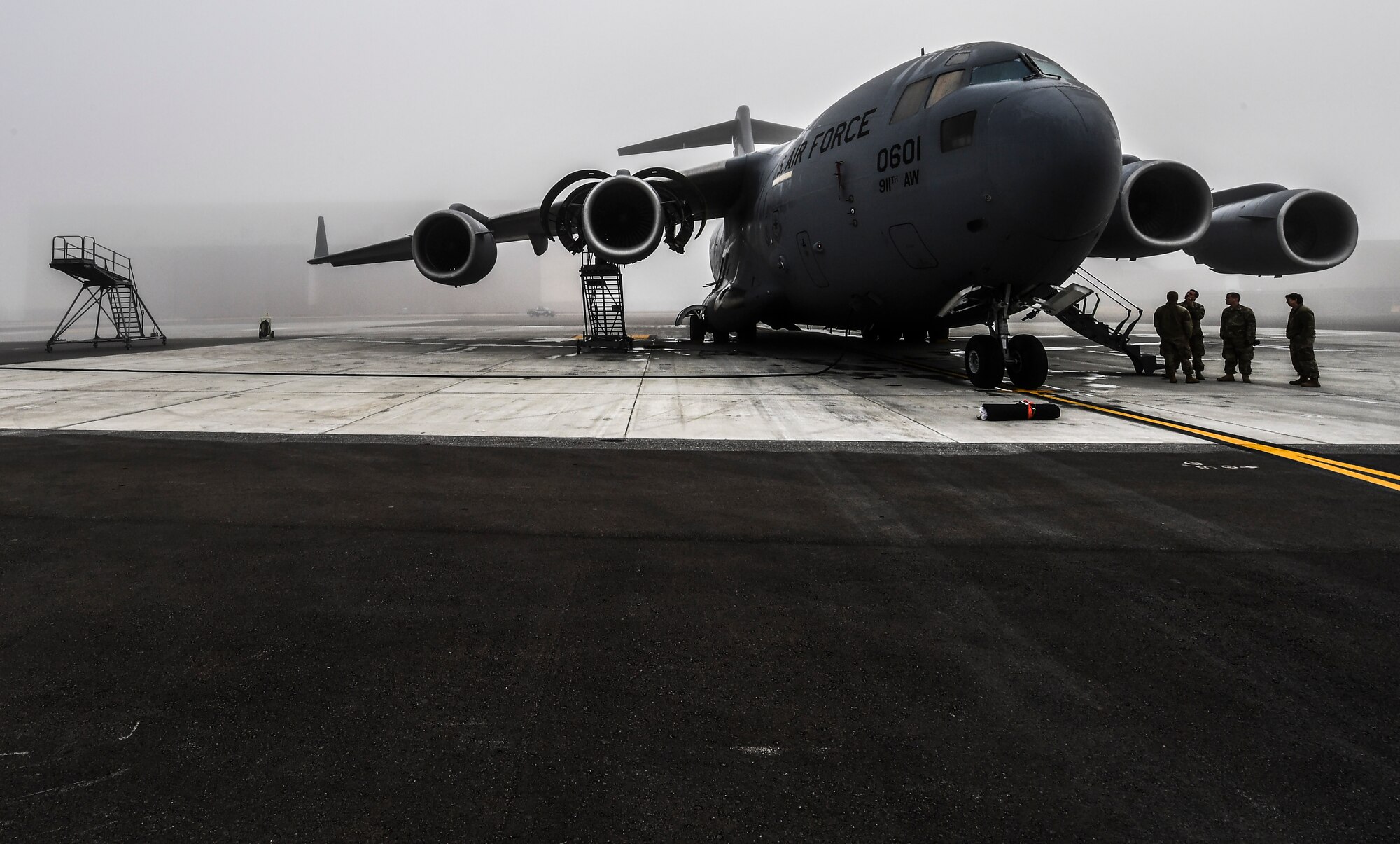A C-17 Globemaster III assigned to the 911th Airlift Wing sits on the flightline while maintenance is performed on one of its engines at the Pittsburgh International Airport Air Reserve Station, Pennsylvania, October 21, 2019.