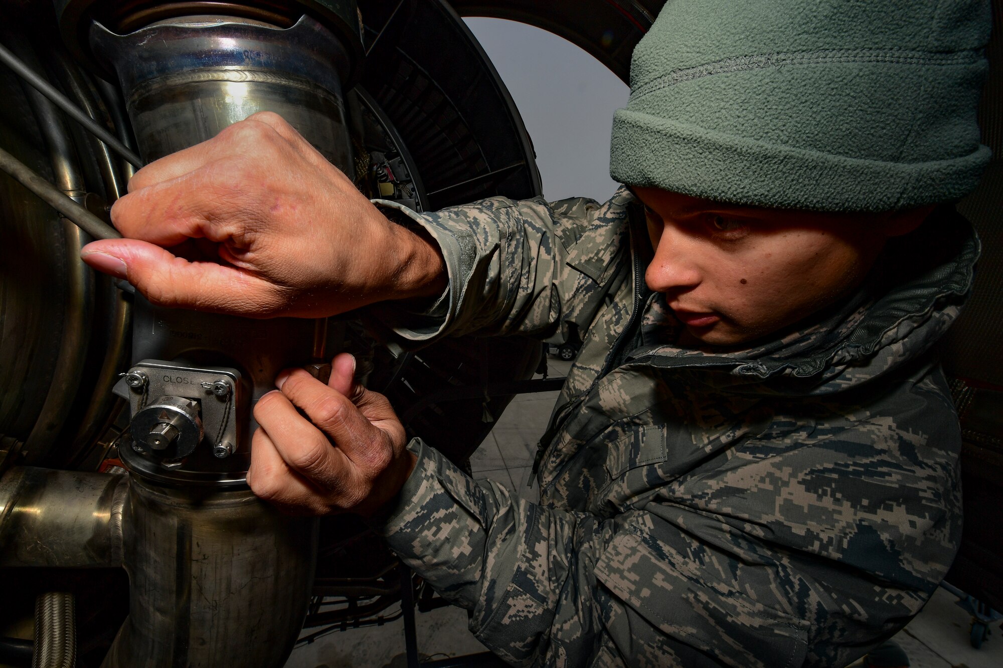 Senior Airman Kawika Hasson, 911th Aircraft Maintenance Squadron electrical and environmental systems technician, replaces a pressure regulator valve on a C-17 engine at the Pittsburgh International Airport Air Reserve Station, Pennsylvania, Oct. 19, 2019.