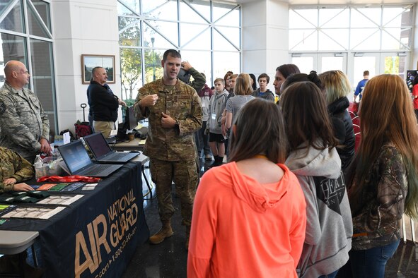 Staff Sgt. Ryan Grinnell, an intelligence analyst with the 123rd Intelligence Squadron, demonstrates a computer simulation of an intelligence, surveillance, and reconnaissance mission to area junior high students at the Fort Smith Public Schools’ ICan Career Expo, held Oct. 22, 2019, in Fort Smith, Arkansas. The 188th Wing’s mission combines ISR, remotely piloted aircraft and targeting to serve state and national military objectives. (U.S. Air National Guard photo by Tech. Sgt. John E. Hillier)