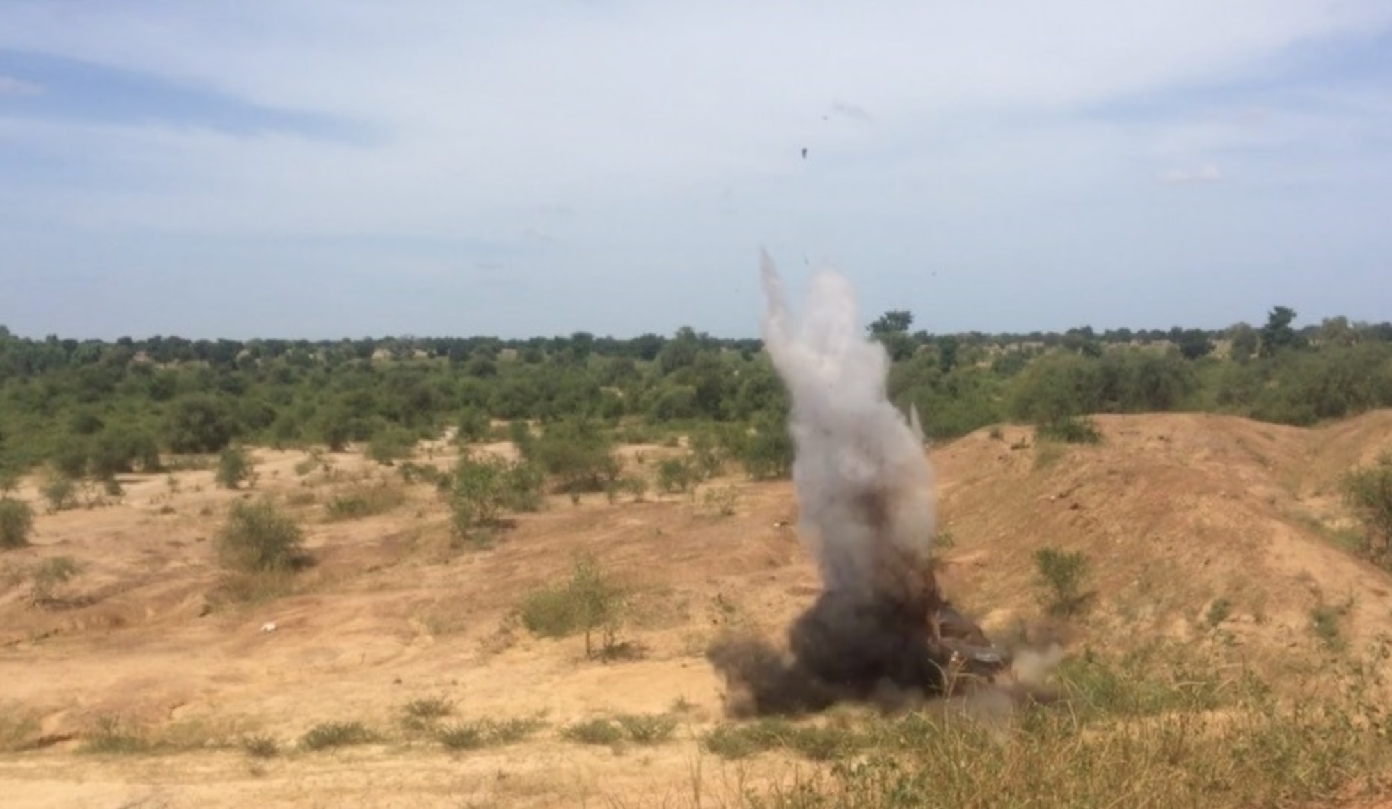 An improvised explosive device detonates inside a vehicle during the Air Force Office of Special Investigations Expeditionary Detachment 2502-led Advanced Post-Blast Analysis and Evidence Preservation Engagement with the Burkinabe Gendarme in Ouagadougou, Burkina Faso, Oct. 7-11, 2019. (Photo by AFOSI EDet 2502)