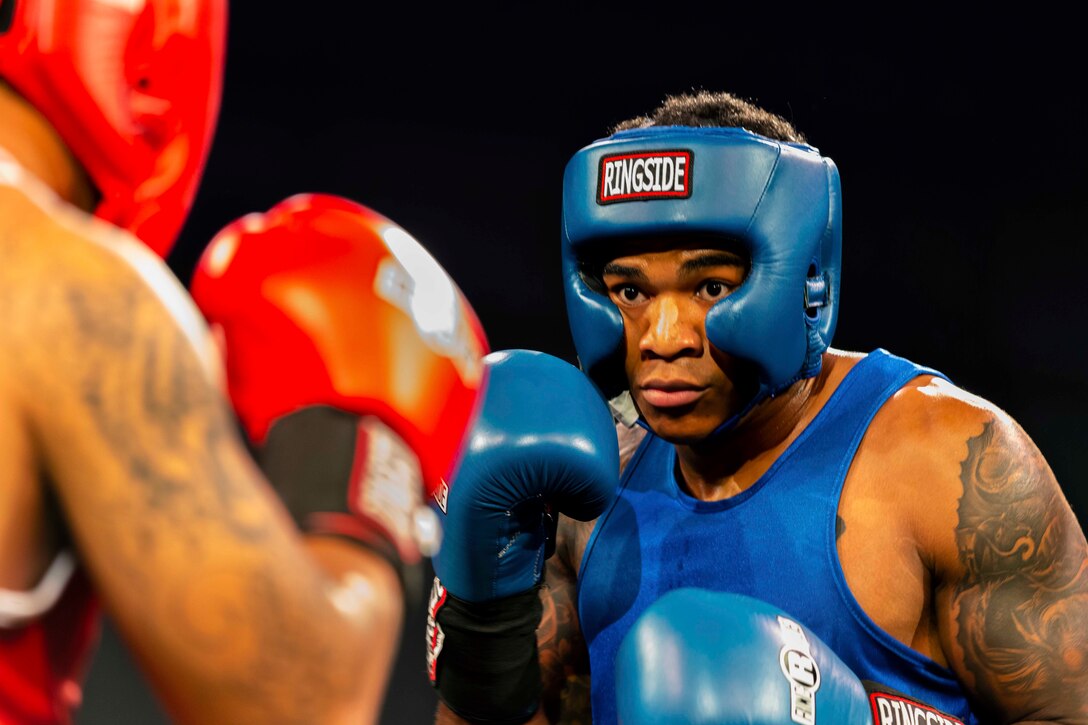 A boxer faces his opponent.