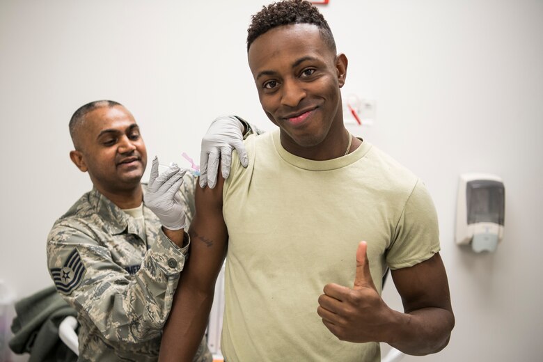 A Freedom Wing member gets vaccinated by a lab tech with the 514th Aerospace Medicine Squadron December 8th, 2018.