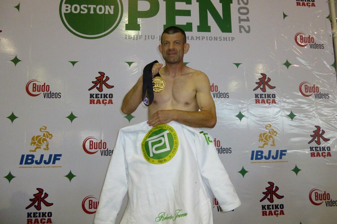 Lt. Col. Caragher, Deputy G-3, 85th U.S. Army Support Command, pauses for at photo at the International 2012 Boston Open, where he earned a gold medal in Brazilian jiu-jitsu. Caragher, is an award-winning Brazilian Jiu-Jitsu competitor.