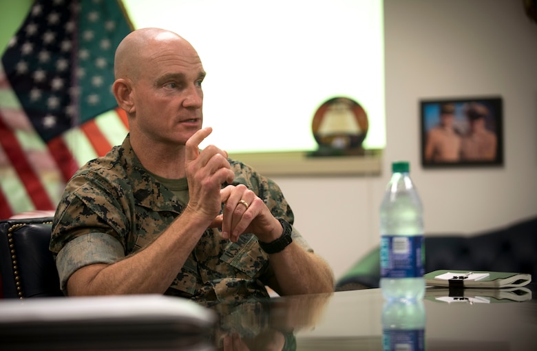 Sergeant Major of the Marine Corps Troy E. Black speaks wtih Master Chief Petty Officer of the Navy Russell Smith. SMMC and MCPON met to discuss naval integration and partnership across the Navy-Marine Corps team.